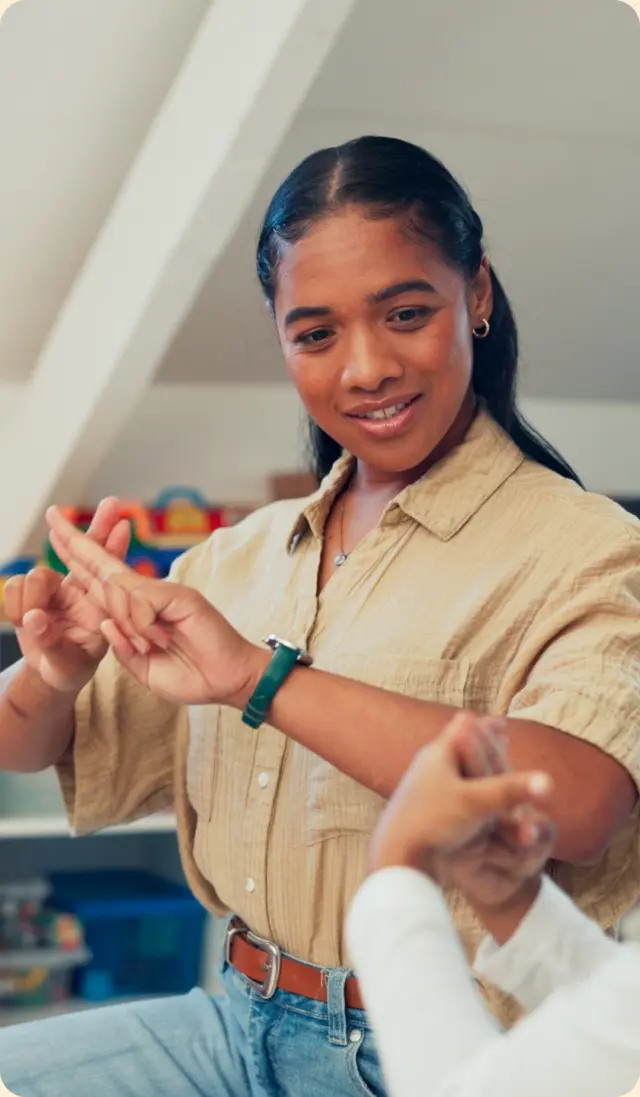 A teacher signing with a learner